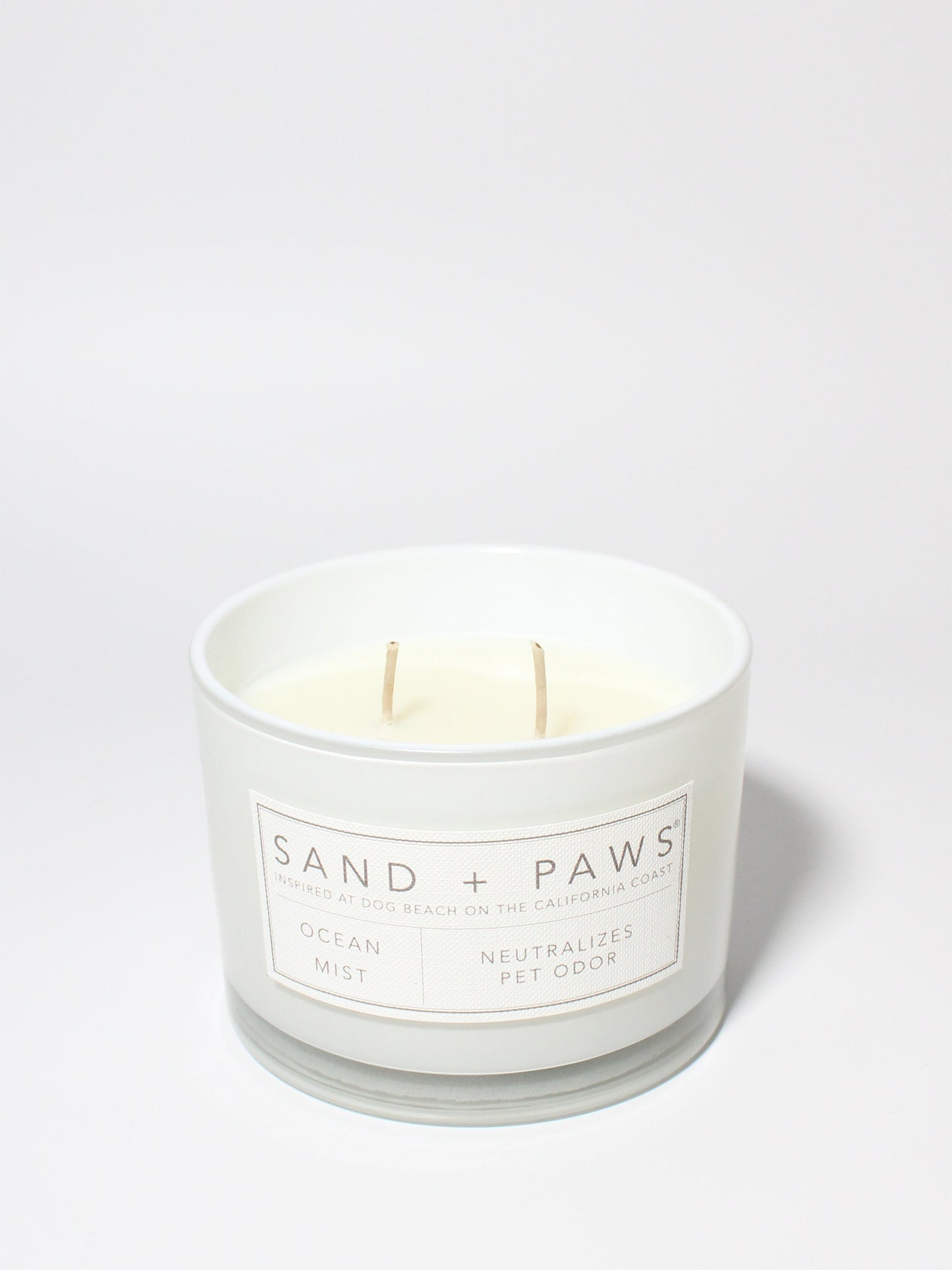 Sand + Paws Ocean Mist 12 oz scented candle White vessel with Carved Paw Print lid